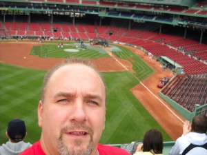 David Gonos standing on the seats above the Green Monster, Fenway Park